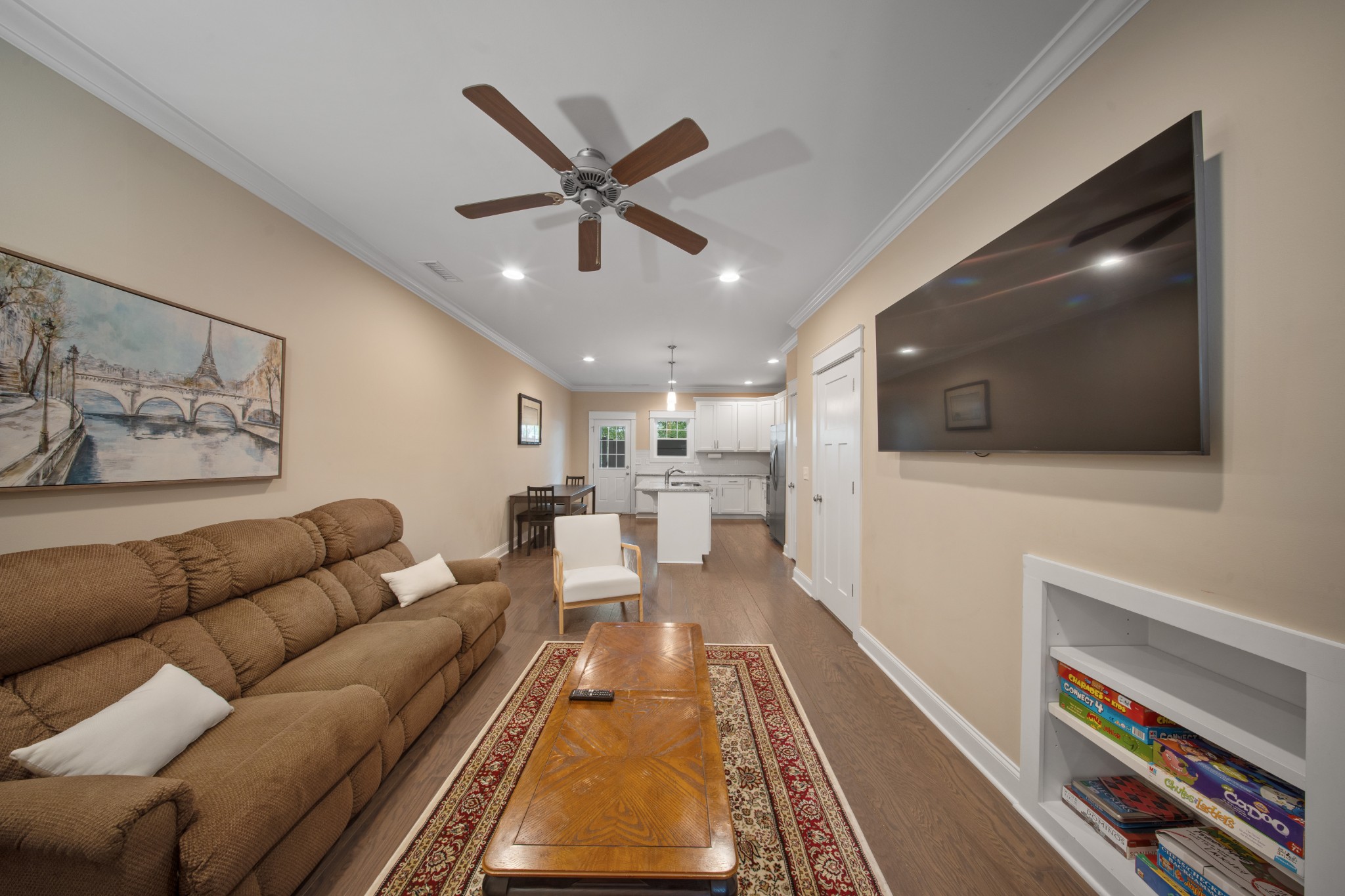 1019 North Maple Street, Unit 2B Murfreesboro, TN 37130 - Photo 3 of 26 a living room with furniture and a flat screen tv