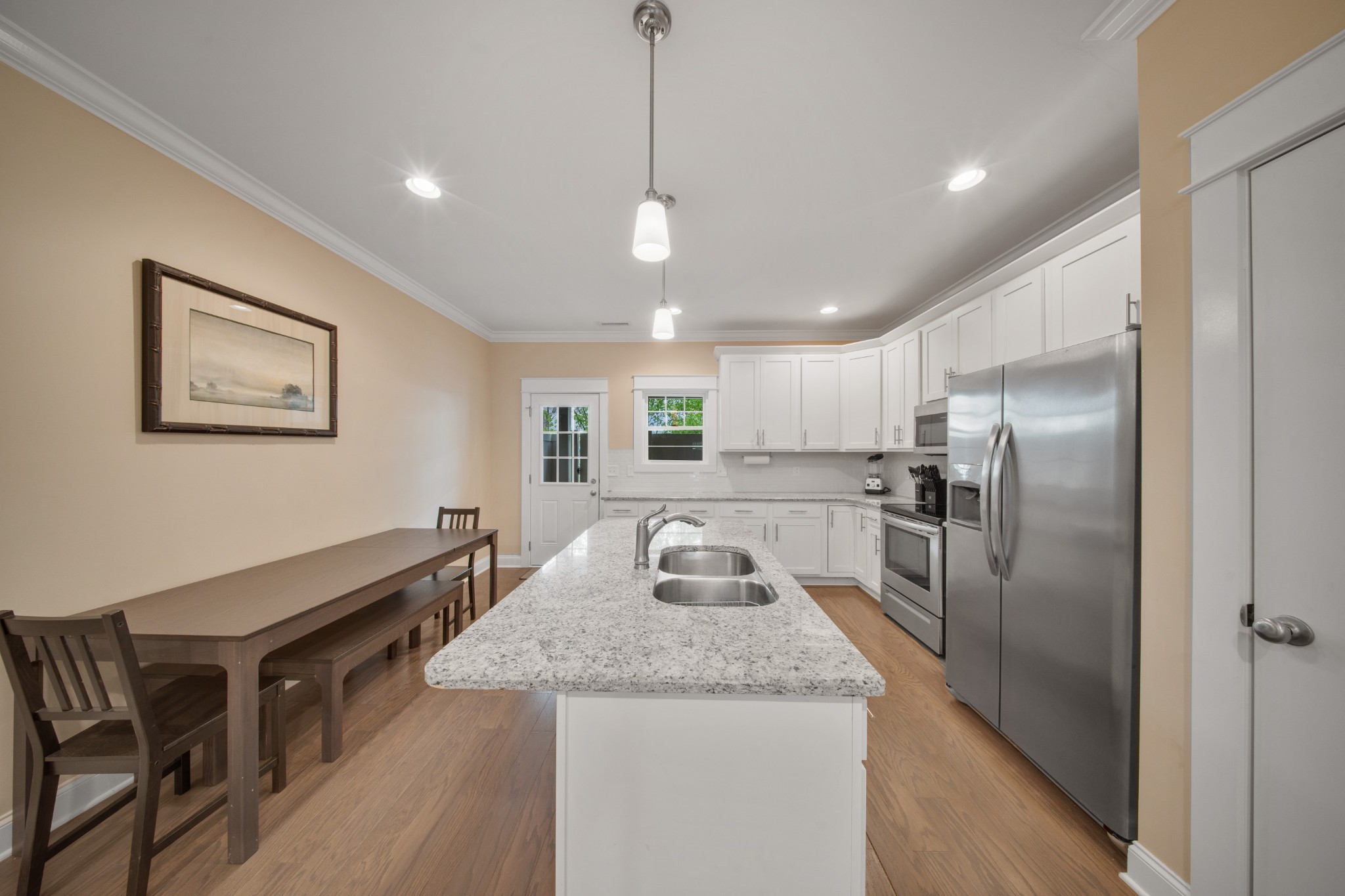 1019 North Maple Street, Unit 2B Murfreesboro, TN 37130 - Photo 7 of 26 a kitchen with stainless steel appliances granite countertop a sink refrigerator and cabinets