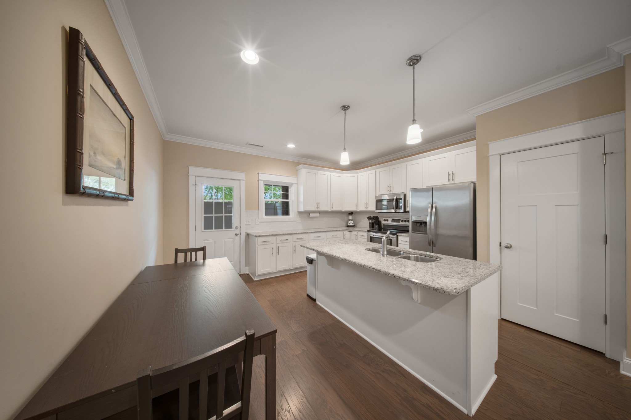 1019 North Maple Street, Unit 2B Murfreesboro, TN 37130 - Photo 8 of 26 a large white kitchen with a large window