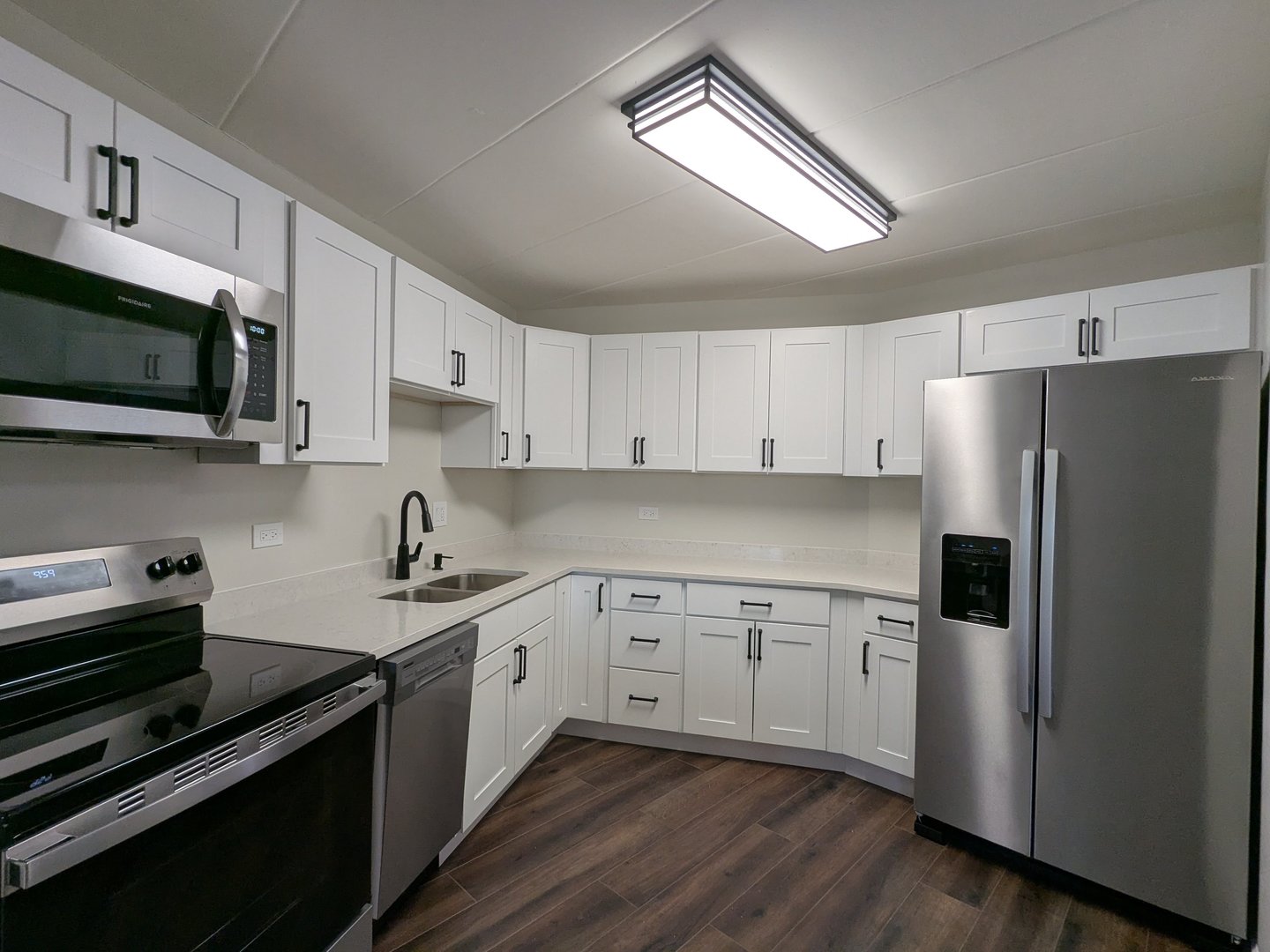 1 Renaissance Place, Unit 408 Palatine, IL 60067 - Photo 6 of 11 a kitchen with cabinets stainless steel appliances a sink and a stove