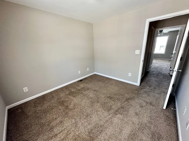 a spacious bathroom with a sink and a mirror