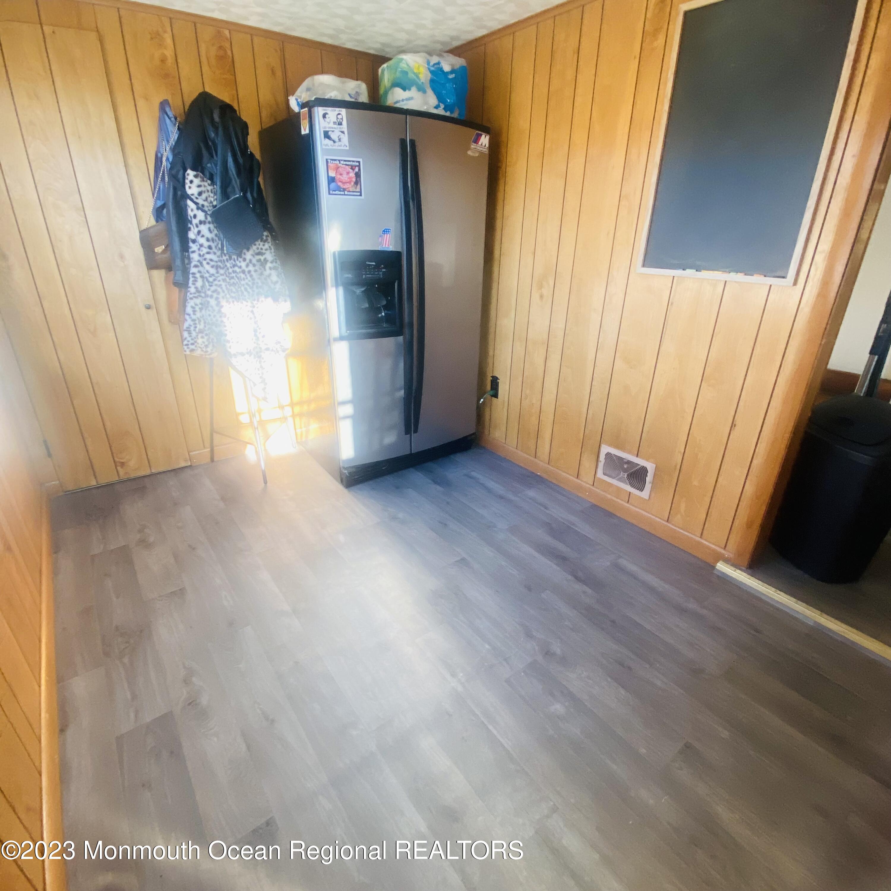 34 Hulse Landing Road Brick, NJ 08723 - Photo 16 of 40 an empty room with wooden floor and windows