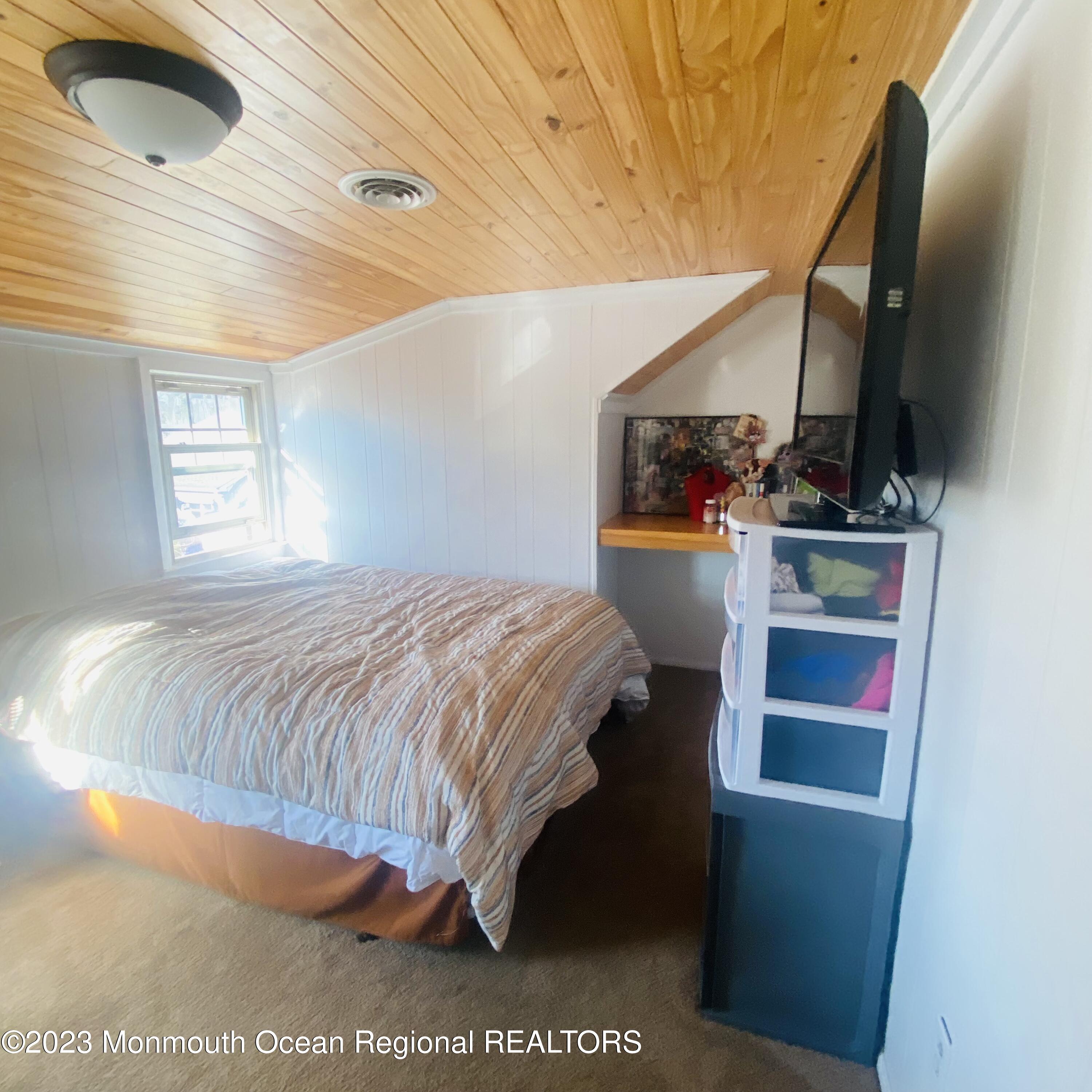 34 Hulse Landing Road Brick, NJ 08723 - Photo 21 of 40 a bedroom with a bed and a flat tv screen on the dresser