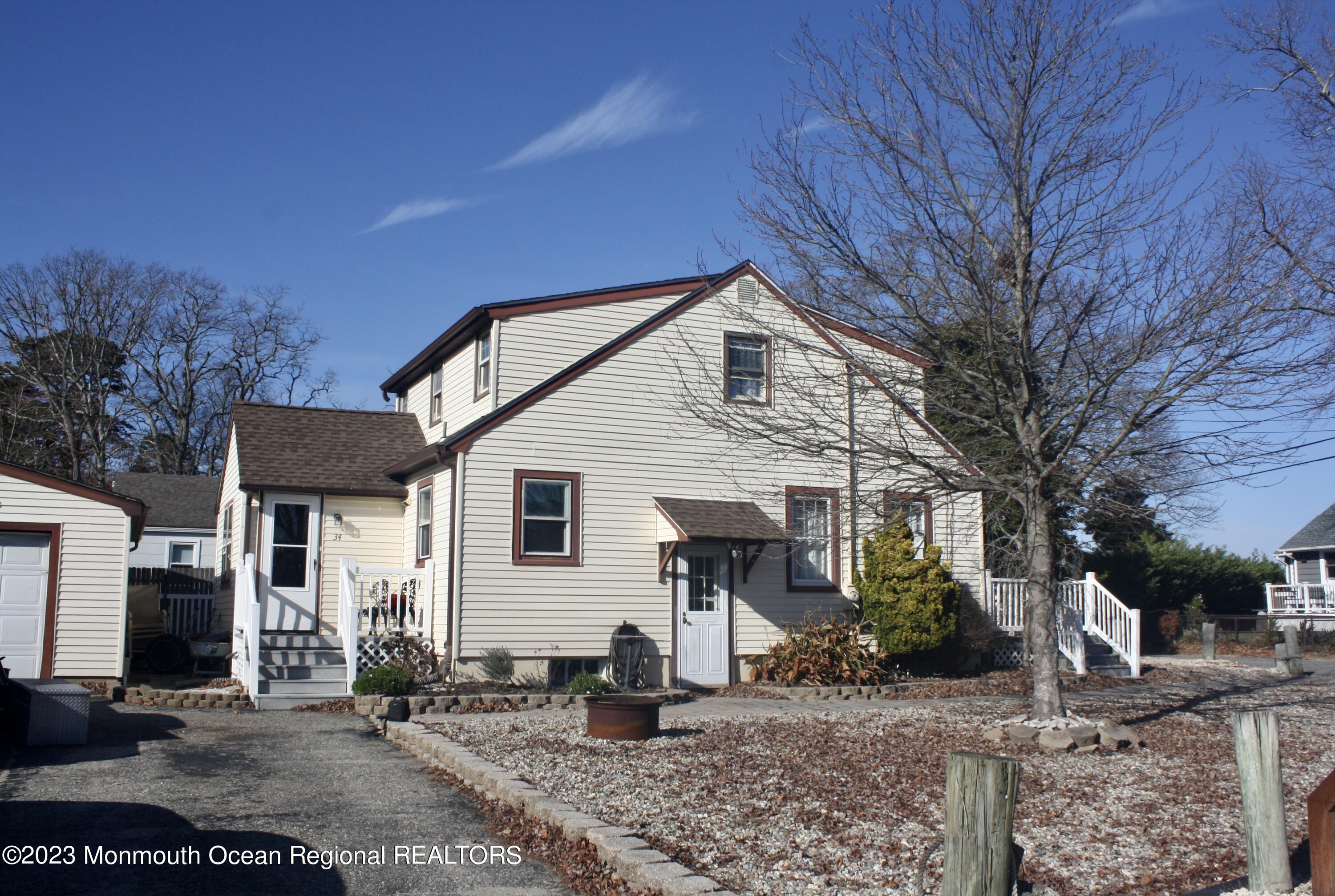 34 Hulse Landing Road Brick, NJ 08723 - Photo 3 of 40 a front view of a house with garden