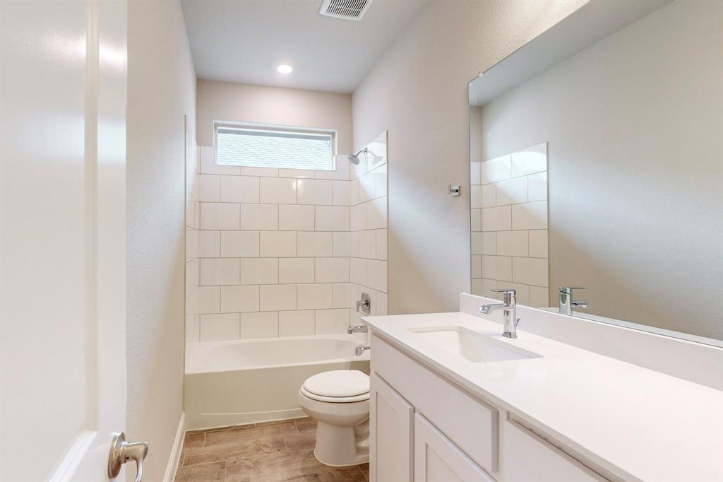 3017 Hampton Path Argyle, TX 76226 - Photo 11 of 37 a bathroom with a sink a toilet and shower