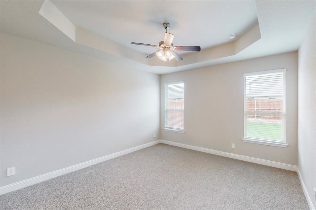 3017 Hampton Path Argyle, TX 76226 - Photo 12 of 37 an empty room with a window and ceiling fan