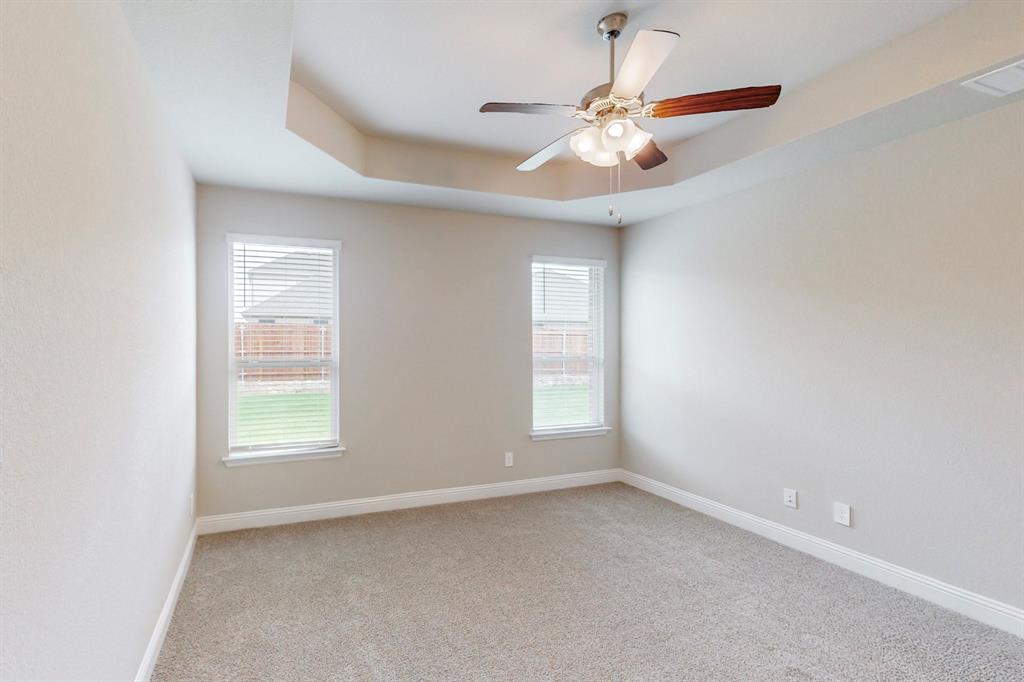 3017 Hampton Path Argyle, TX 76226 - Photo 13 of 37 an empty room with windows and fan