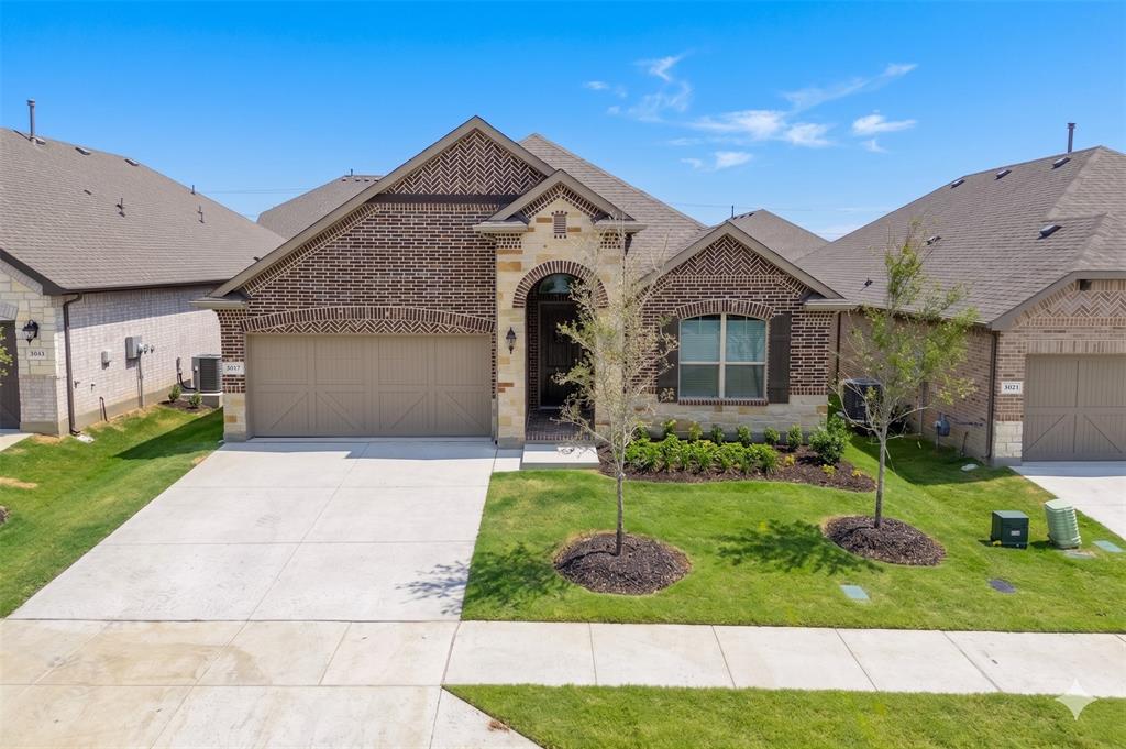 3017 Hampton Path Argyle, TX 76226 - Photo 2 of 37 a front view of a house with a yard