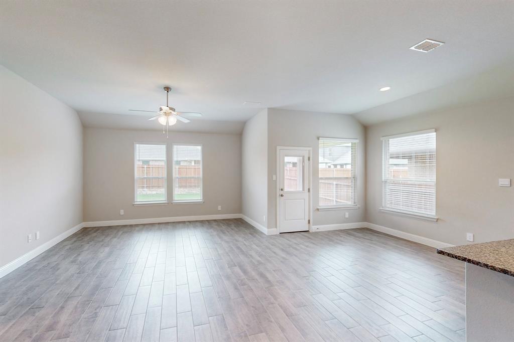 3017 Hampton Path Argyle, TX 76226 - Photo 5 of 37 an empty room with wooden floor and windows