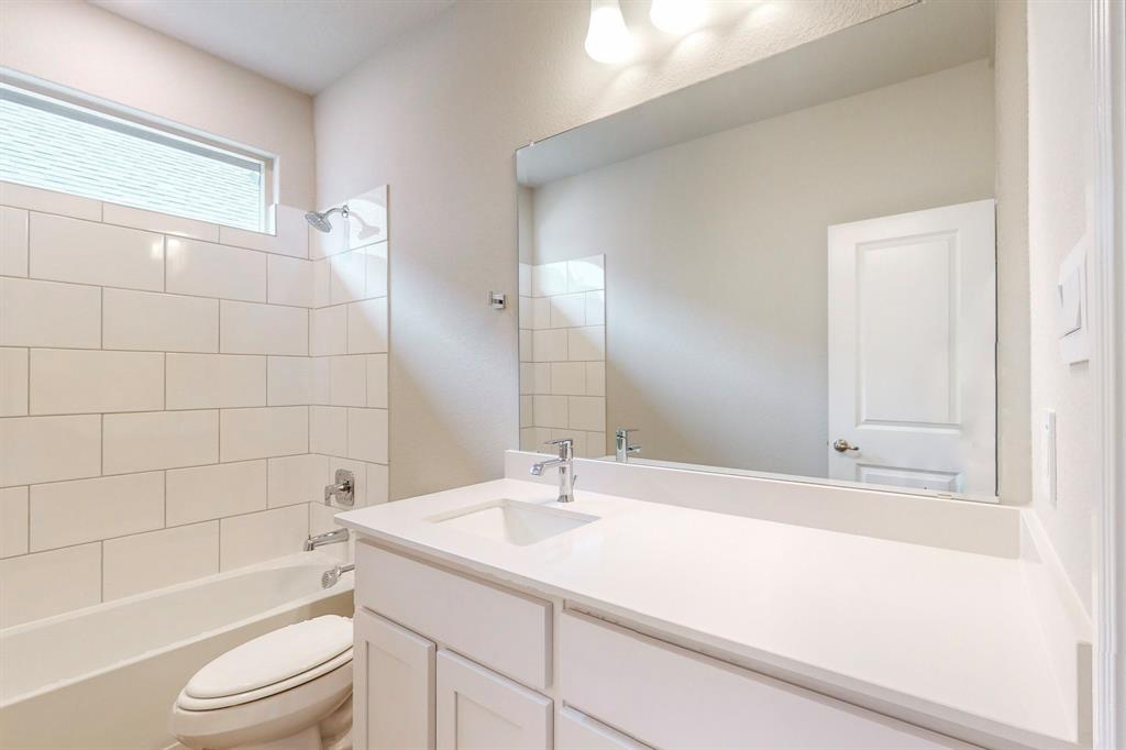 3017 Hampton Path Argyle, TX 76226 - Photo 9 of 37 a bathroom with a sink a toilet and shower