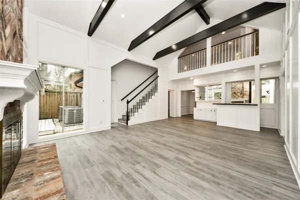a view of an entryway with wooden floor