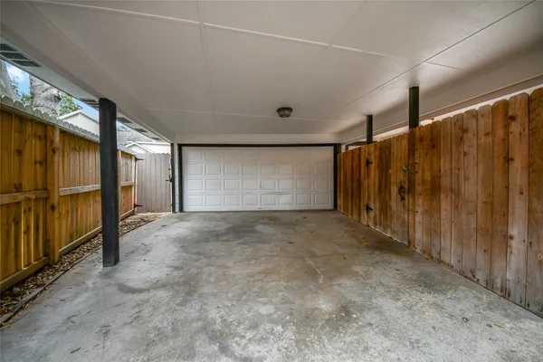 a view of empty room with wooden walls