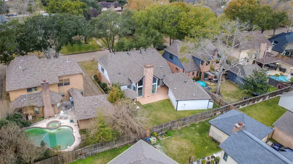 an aerial view of a house with a garden