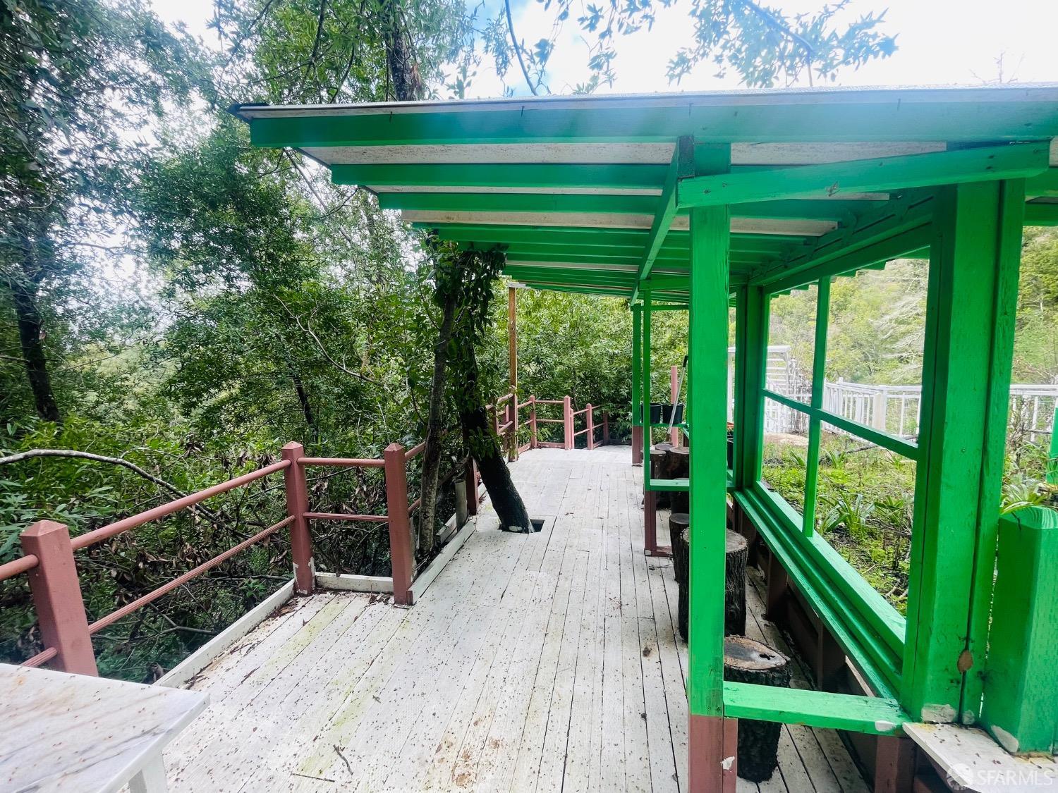 0 Sunset View Road Los Gatos, CA 95033 - Photo 11 of 25 a balcony with couple of trees and flowers