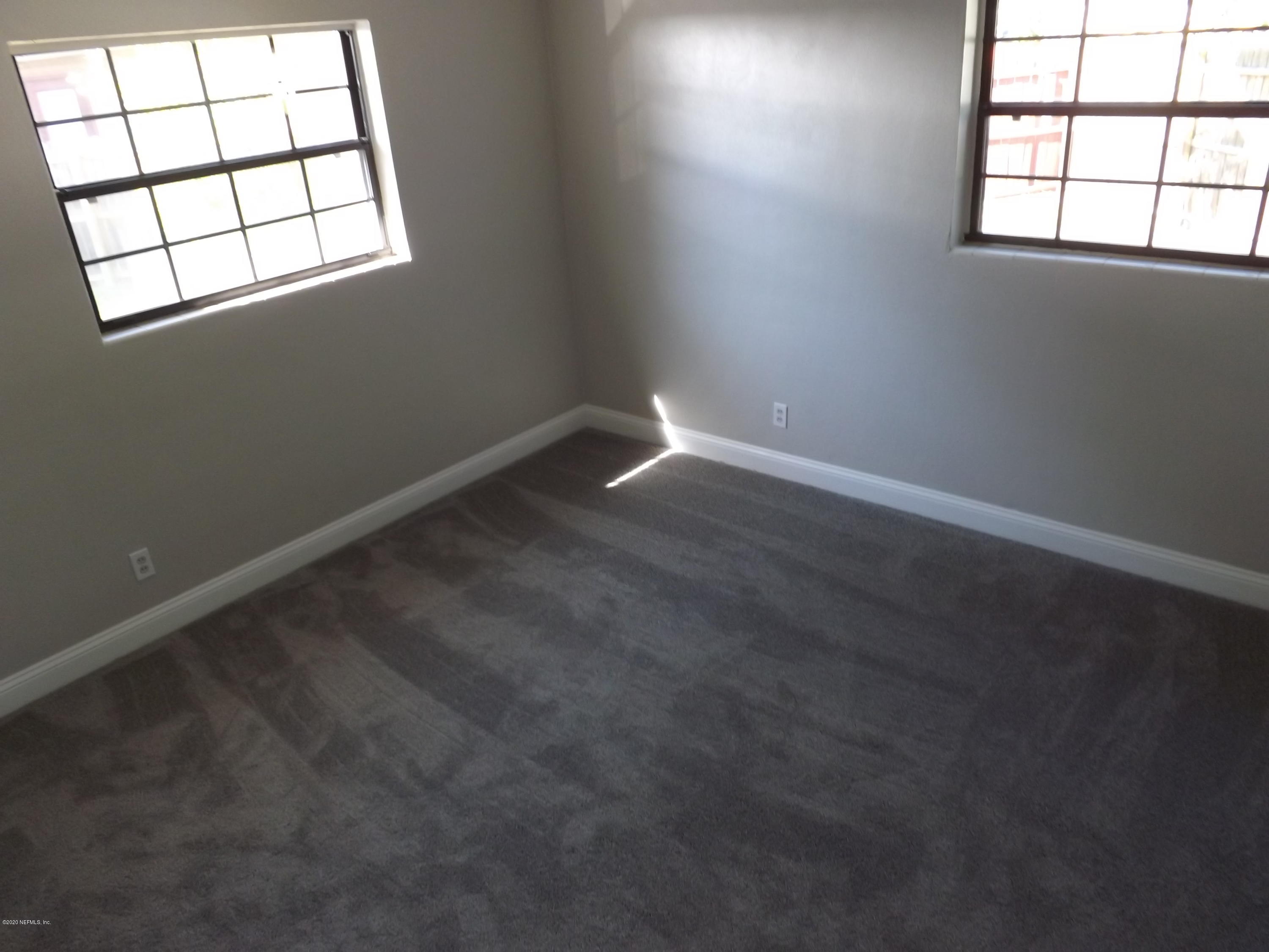 3565 Rogero Road Jacksonville, FL 32277 - Photo 28 of 74 an empty room with a window