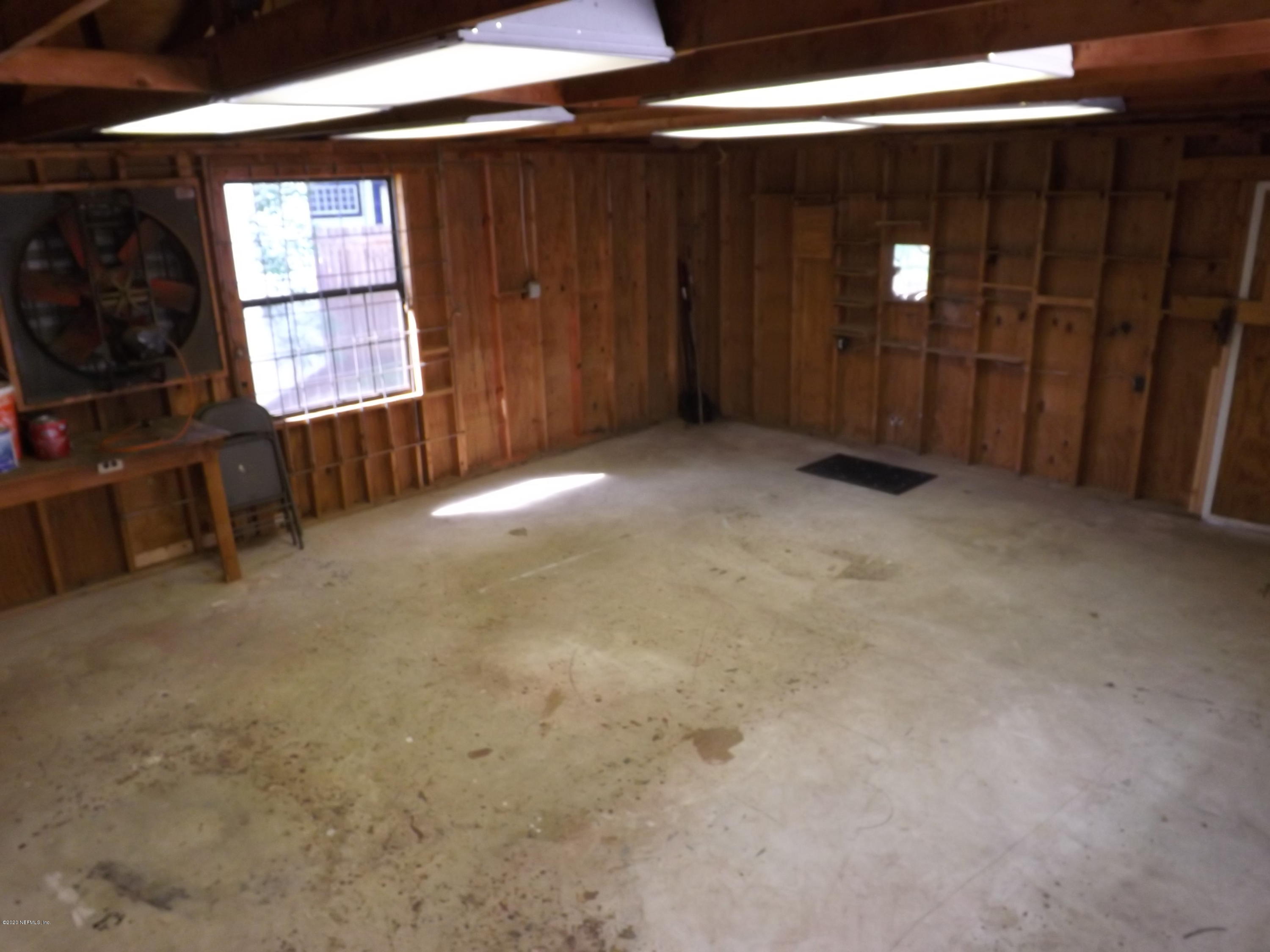 3565 Rogero Road Jacksonville, FL 32277 - Photo 34 of 74 a view of empty room with windows