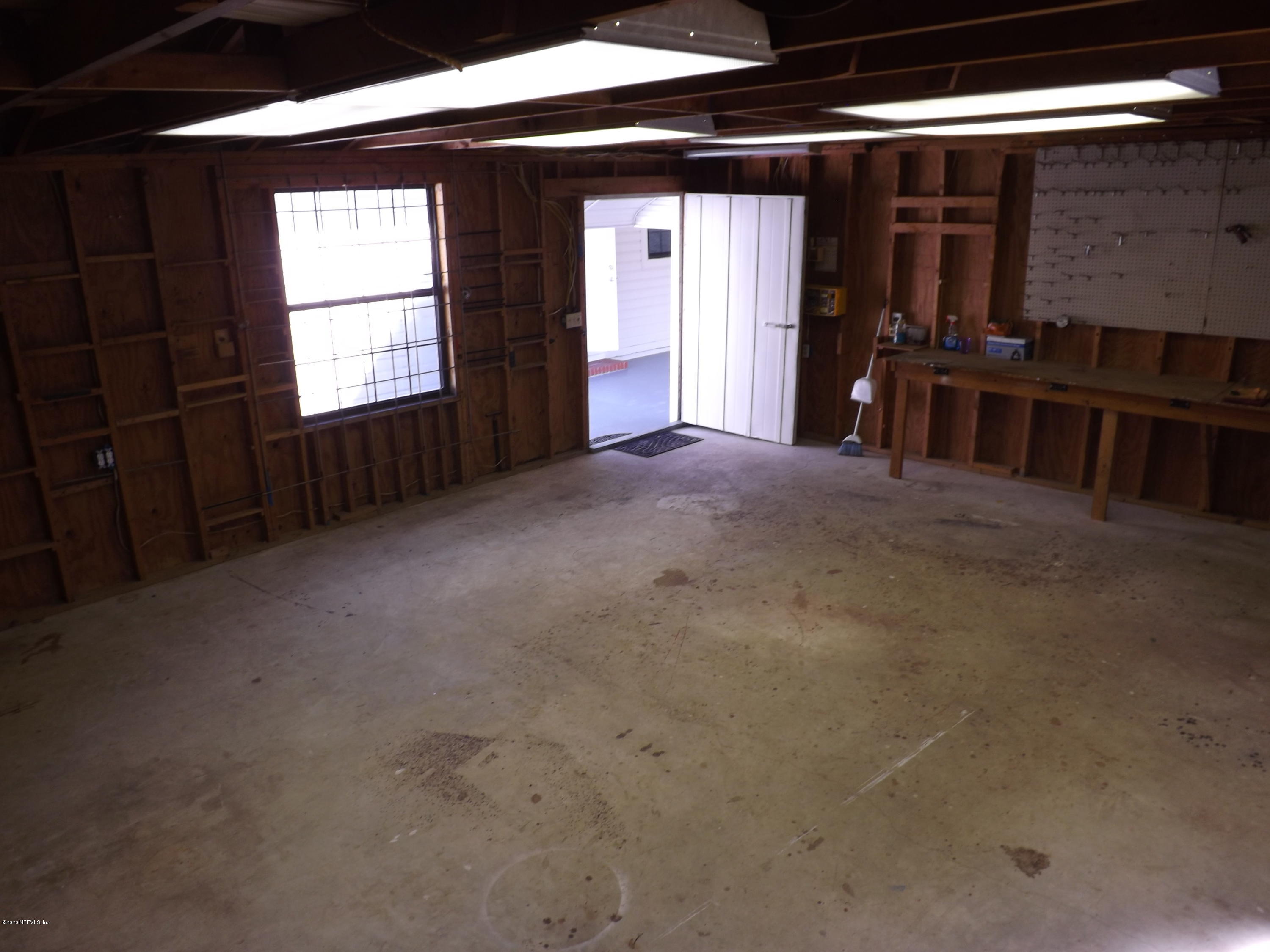 3565 Rogero Road Jacksonville, FL 32277 - Photo 37 of 74 a view of empty room with windows