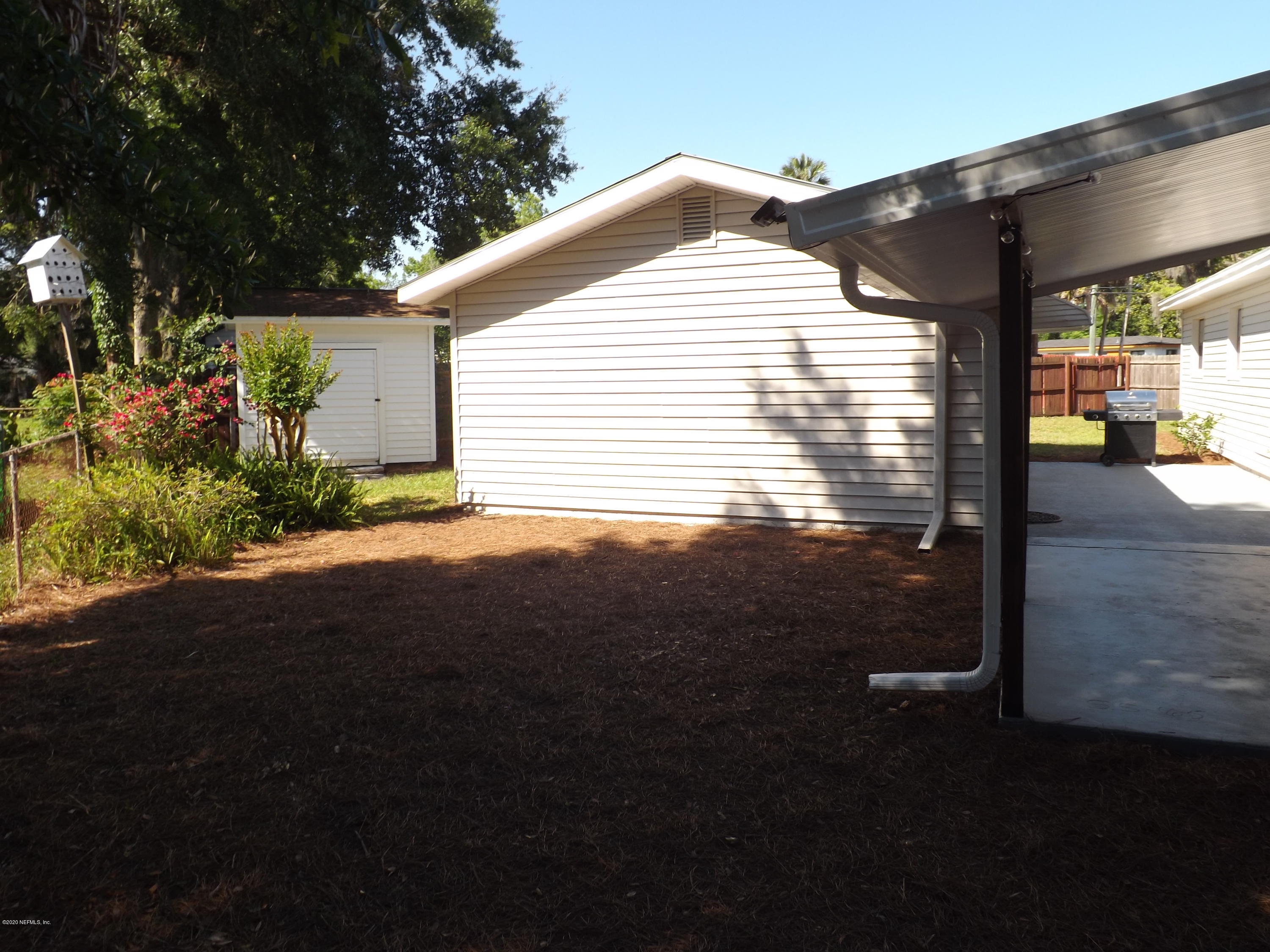 3565 Rogero Road Jacksonville, FL 32277 - Photo 42 of 74 a view of a house with backyard