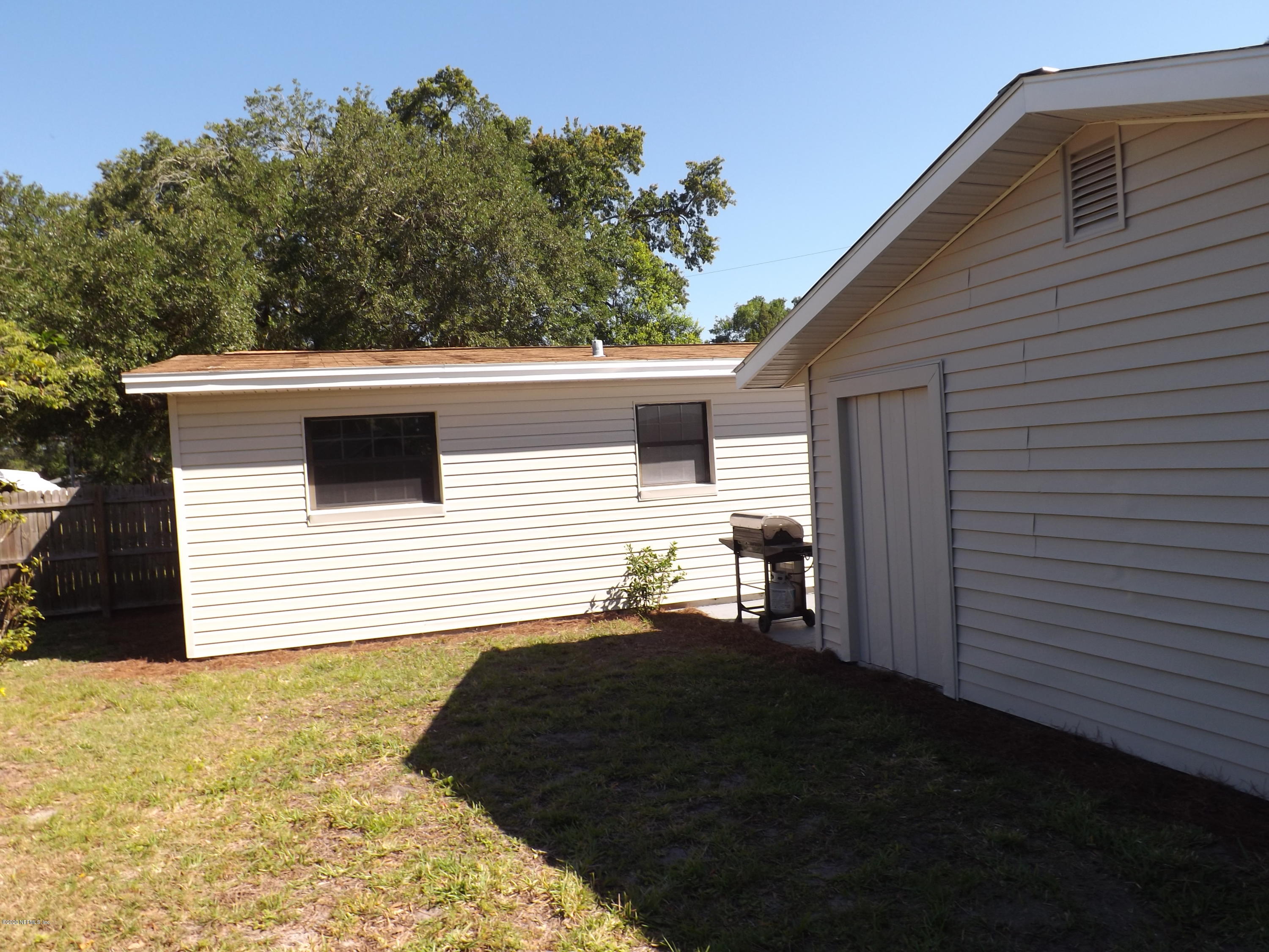 3565 Rogero Road Jacksonville, FL 32277 - Photo 47 of 74 a backyard of a house