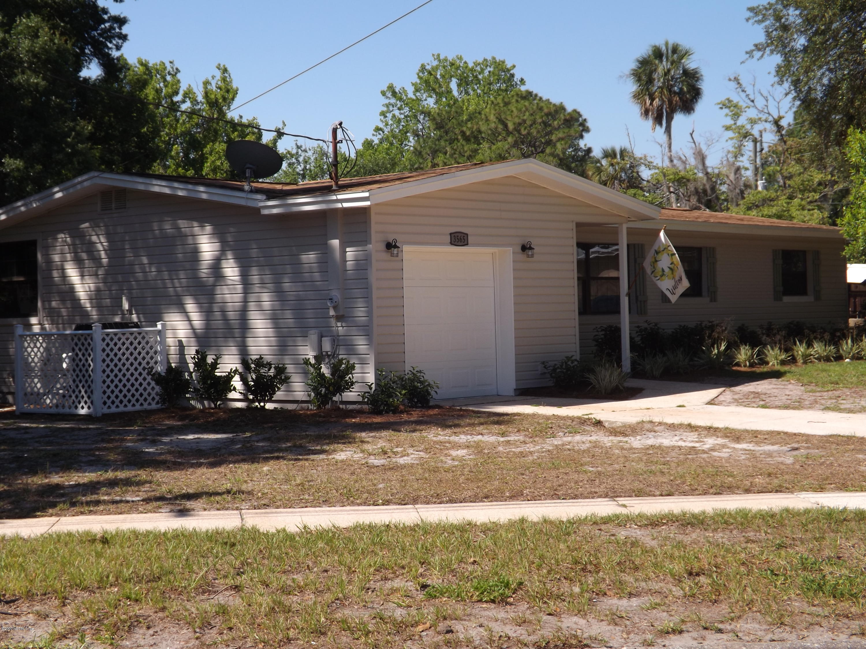3565 Rogero Road Jacksonville, FL 32277 - Photo 57 of 74 a front view of house with yard