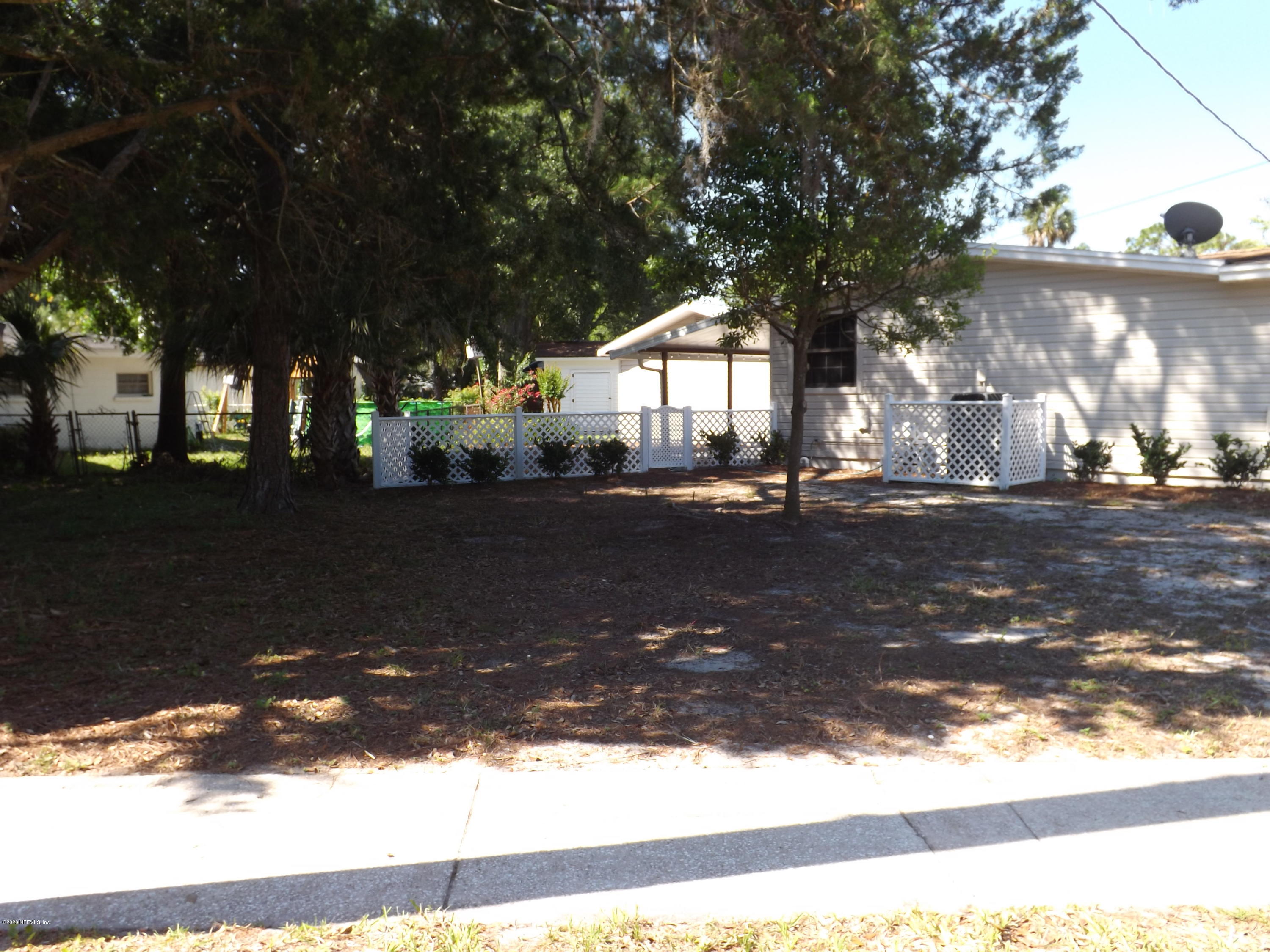 3565 Rogero Road Jacksonville, FL 32277 - Photo 61 of 74 a view of street with trees