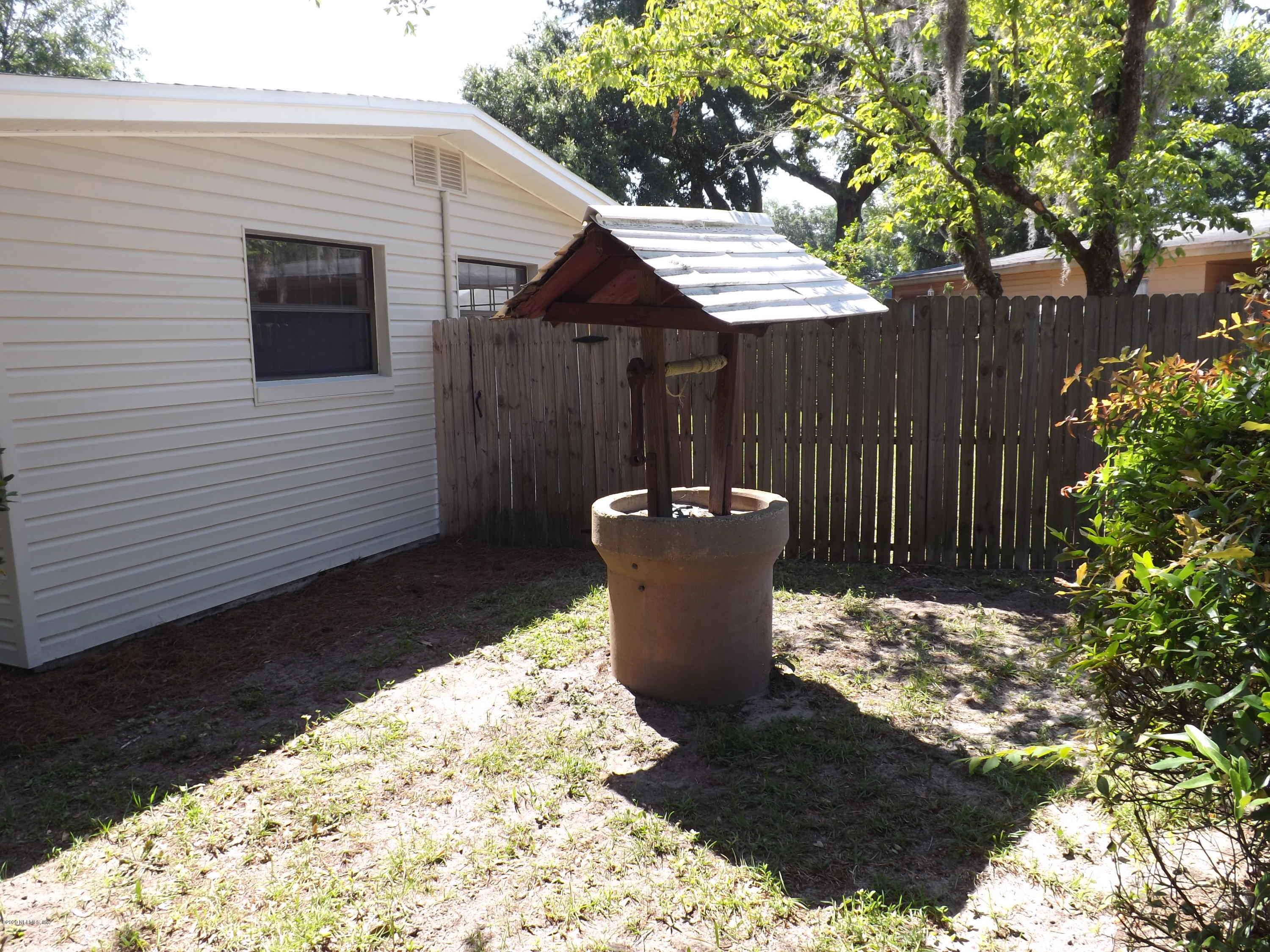3565 Rogero Road Jacksonville, FL 32277 - Photo 69 of 74 a view of a small house with backyard