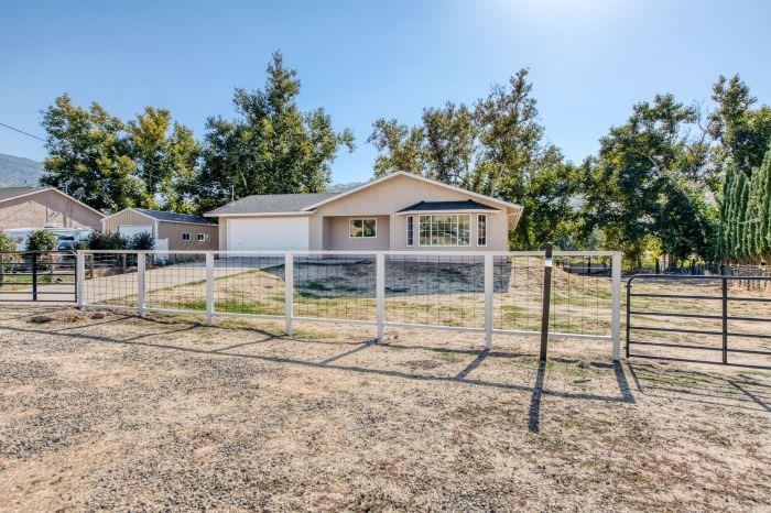 a house with trees in the background