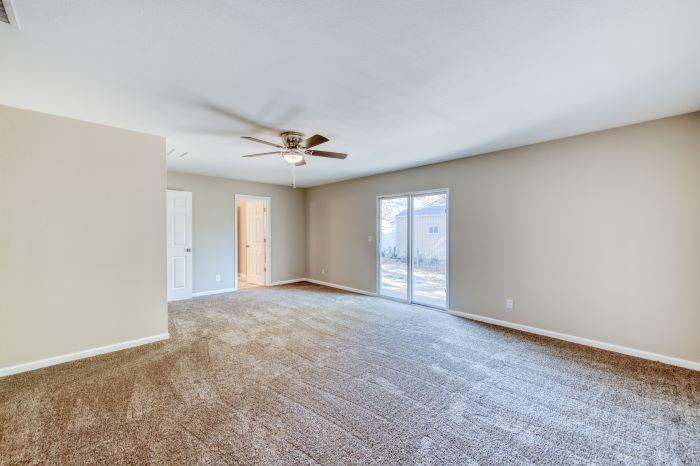 6153 Big Oak Road Sanger, CA 93657 - Photo 11 of 23 a view of an empty room with window and chandelier fan