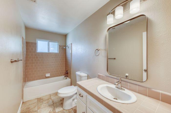6153 Big Oak Road Sanger, CA 93657 - Photo 18 of 23 a bathroom with a sink toilet and shower