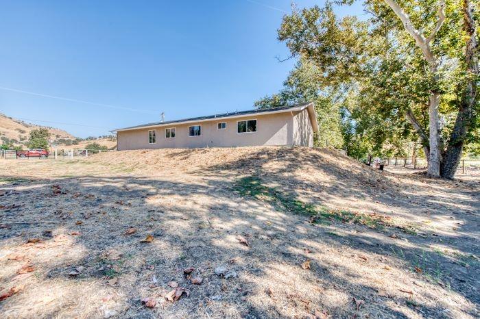 6153 Big Oak Road Sanger, CA 93657 - Photo 21 of 23 a view of a big yard with large trees