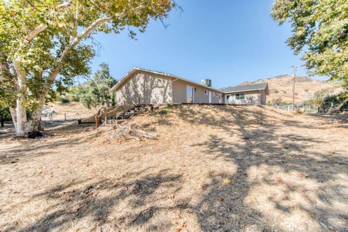 6153 Big Oak Road Sanger, CA 93657 - Photo 22 of 23 a view of a house with a snow in the yard