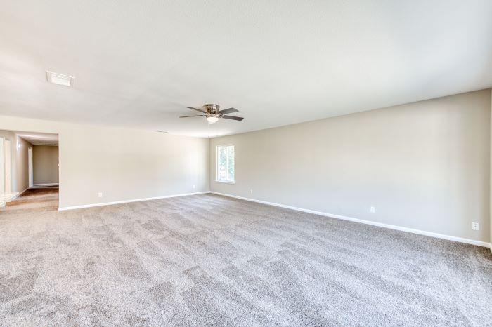 6153 Big Oak Road Sanger, CA 93657 - Photo 4 of 23 a view of an empty room with a chandelier fan