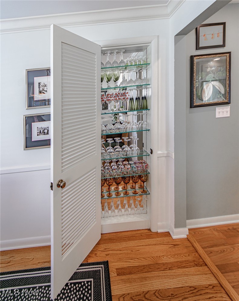 696 Ecton Road Akron, OH 44303 - Photo 31 of 41 The secret door in the dining room, with glass shelving, is perfect for your entertaining glassware.