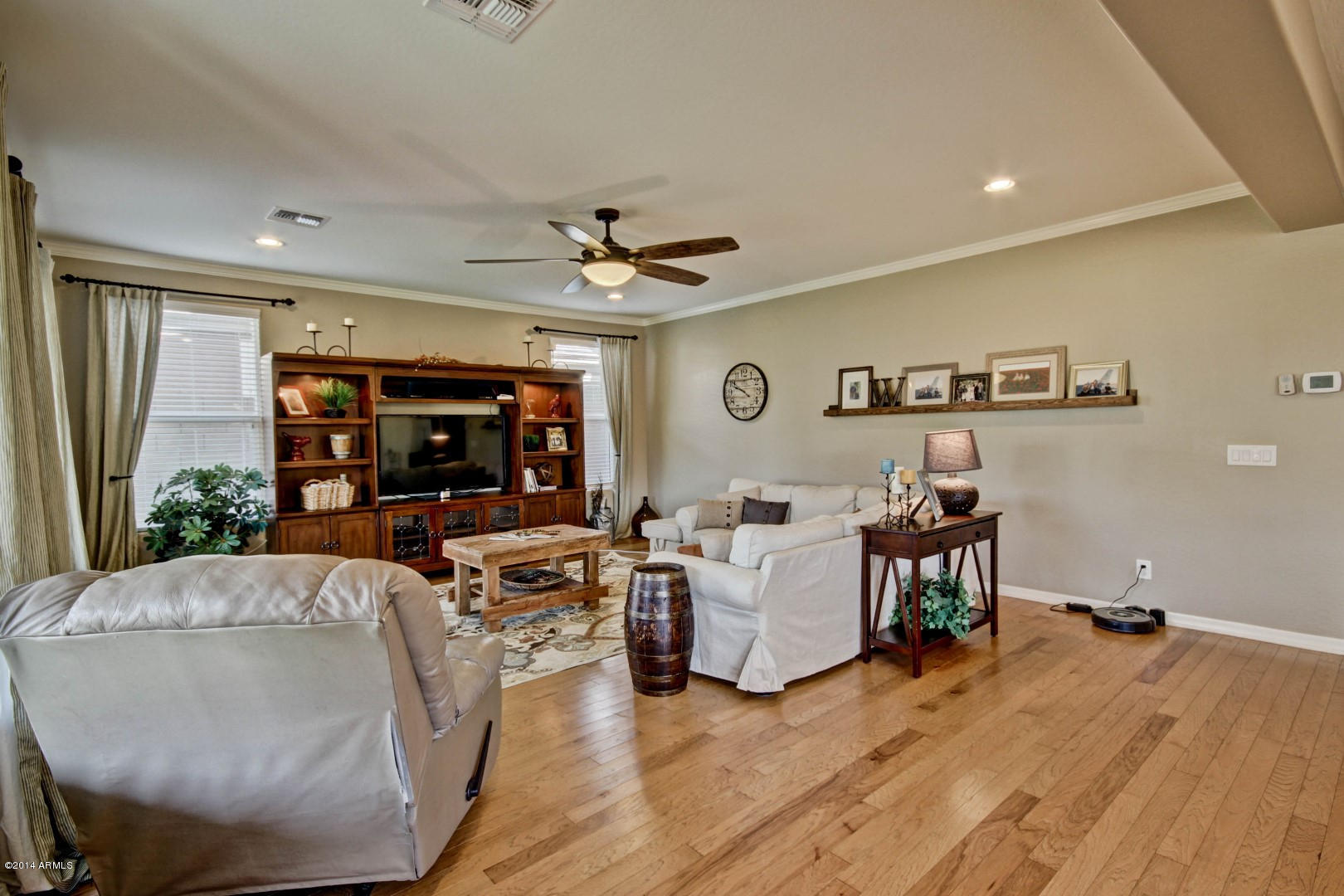 2280 North Alsap Road Buckeye, AZ 85396 - Photo 16 of 65 a living room with fireplace furniture and a large window