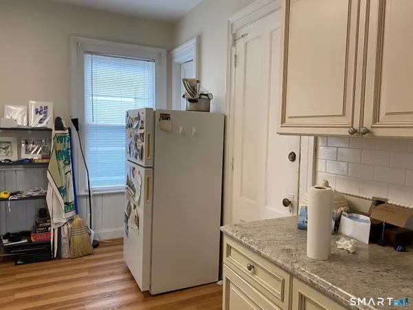 a bathroom with a toilet and a shower curtain