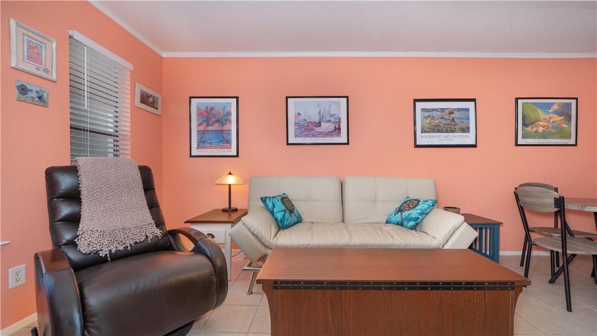 2290 North Fulton Beach Road Rockport, TX 78382 - Photo 12 of 26 a living room with furniture and wall paintings