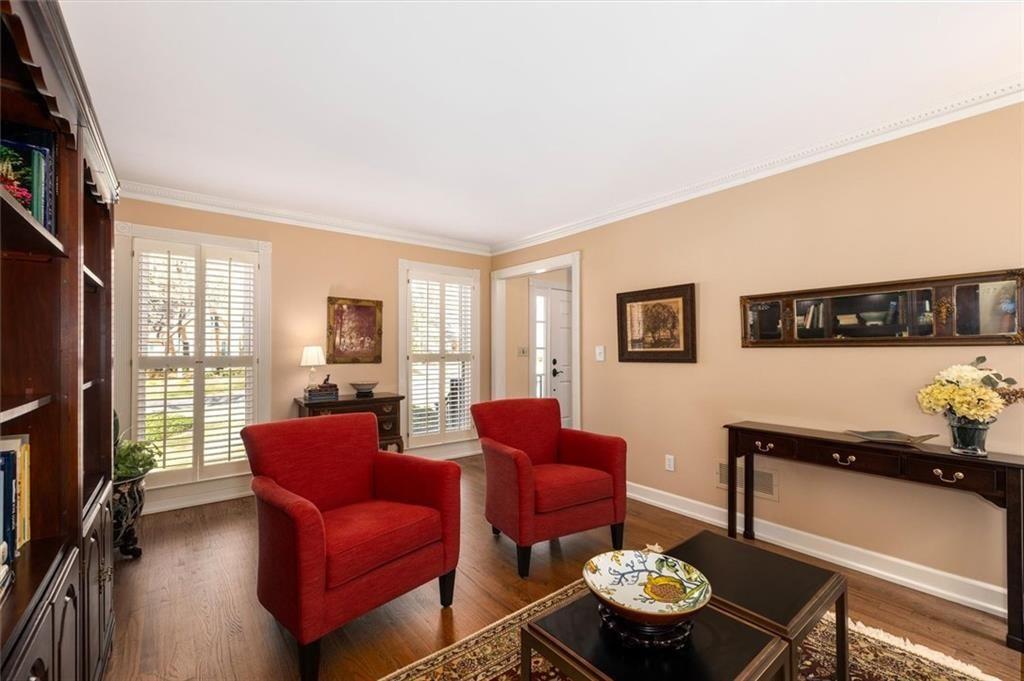 4890 Forestglade Court Smoke Rise, GA 30087 - Photo 11 of 50 a living room with furniture and a flat screen tv
