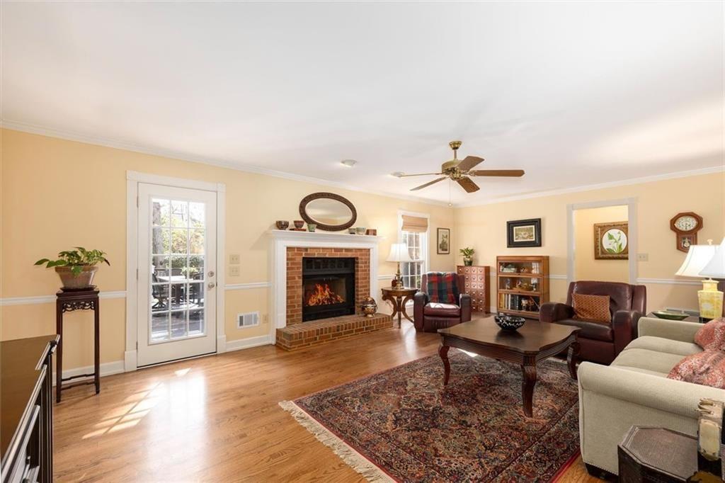 4890 Forestglade Court Smoke Rise, GA 30087 - Photo 14 of 50 a living room with furniture and a fireplace