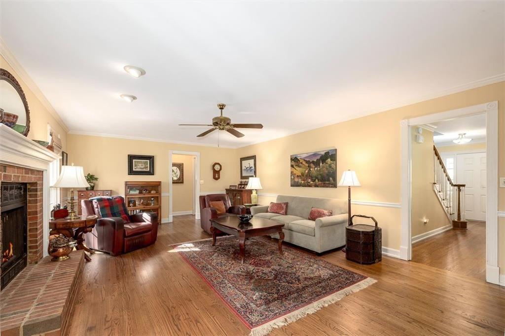 4890 Forestglade Court Smoke Rise, GA 30087 - Photo 15 of 50 a living room with furniture and a fireplace