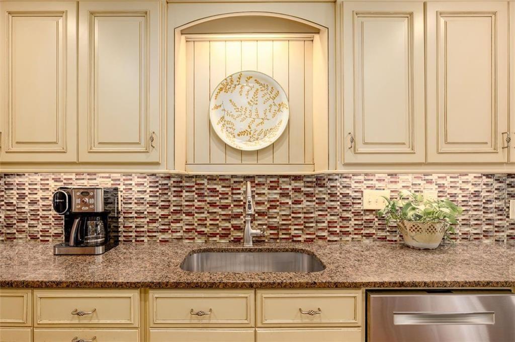 4890 Forestglade Court Smoke Rise, GA 30087 - Photo 23 of 50 a bathroom with sink and mirror