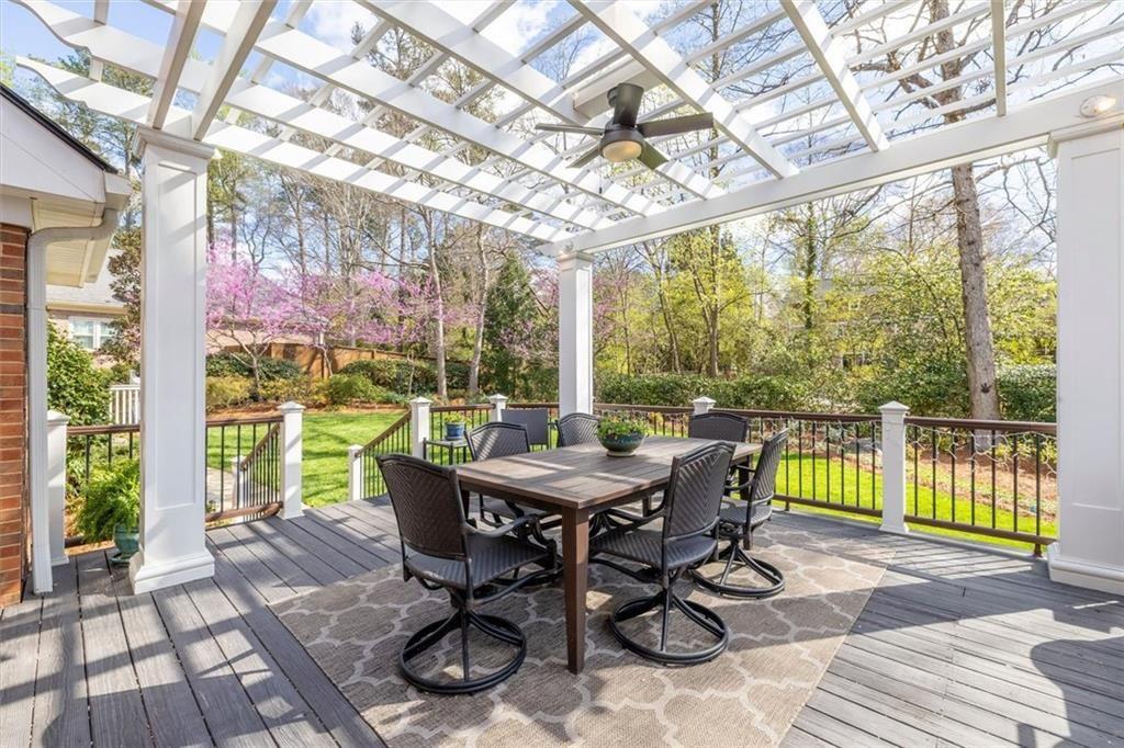 4890 Forestglade Court Smoke Rise, GA 30087 - Photo 26 of 50 a view of a patio with a table chairs and a backyard
