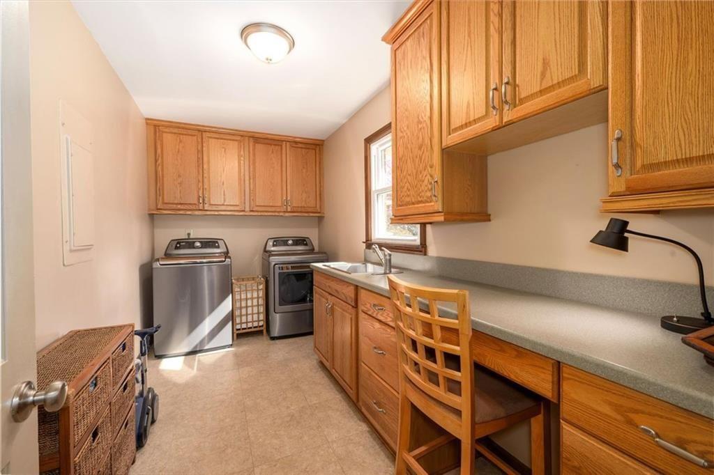 4890 Forestglade Court Smoke Rise, GA 30087 - Photo 29 of 50 a kitchen with stainless steel appliances granite countertop a sink and cabinets