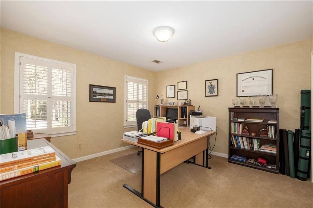 4890 Forestglade Court Smoke Rise, GA 30087 - Photo 34 of 50 a living room with furniture and a window