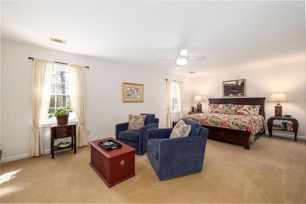 4890 Forestglade Court Smoke Rise, GA 30087 - Photo 36 of 50 a living room with furniture and a dresser
