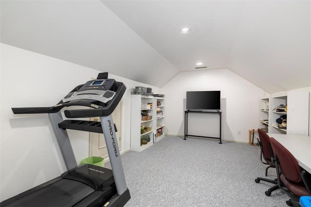 4890 Forestglade Court Smoke Rise, GA 30087 - Photo 41 of 50 a living room with furniture and a flat screen tv