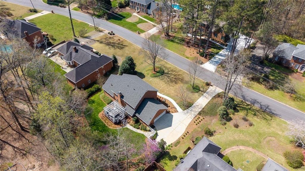 4890 Forestglade Court Smoke Rise, GA 30087 - Photo 47 of 50 an aerial view of a house with a yard