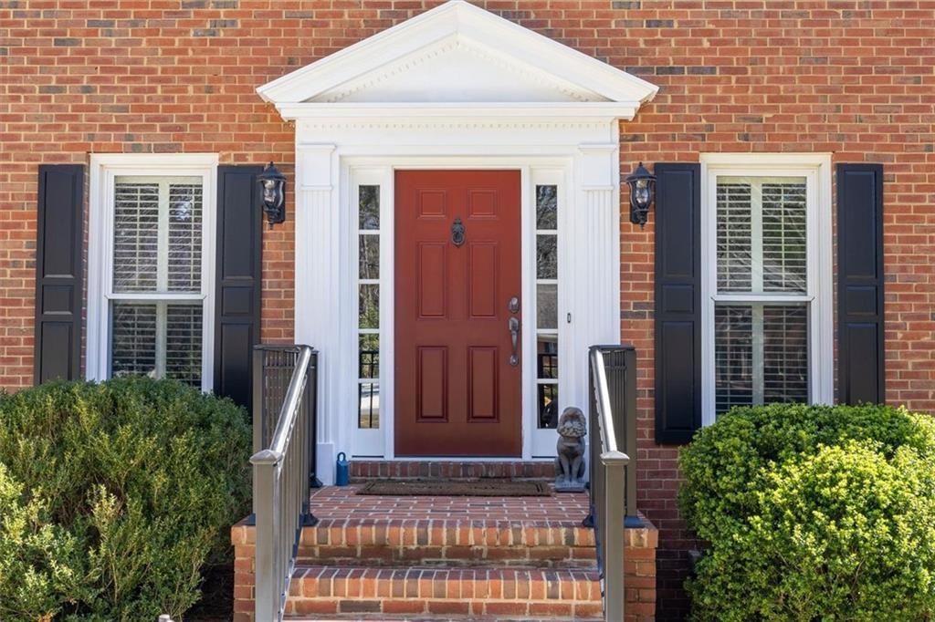4890 Forestglade Court Smoke Rise, GA 30087 - Photo 7 of 50 a view of front door and potted plants