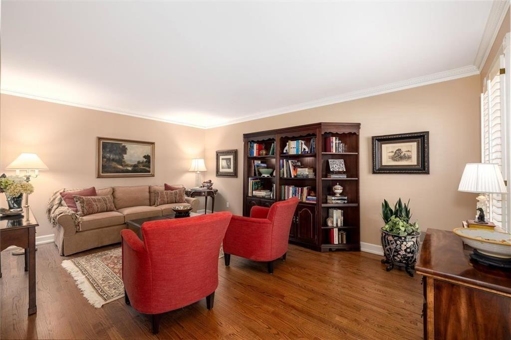 4890 Forestglade Court Smoke Rise, GA 30087 - Photo 10 of 50 a living room with furniture and a wooden floor