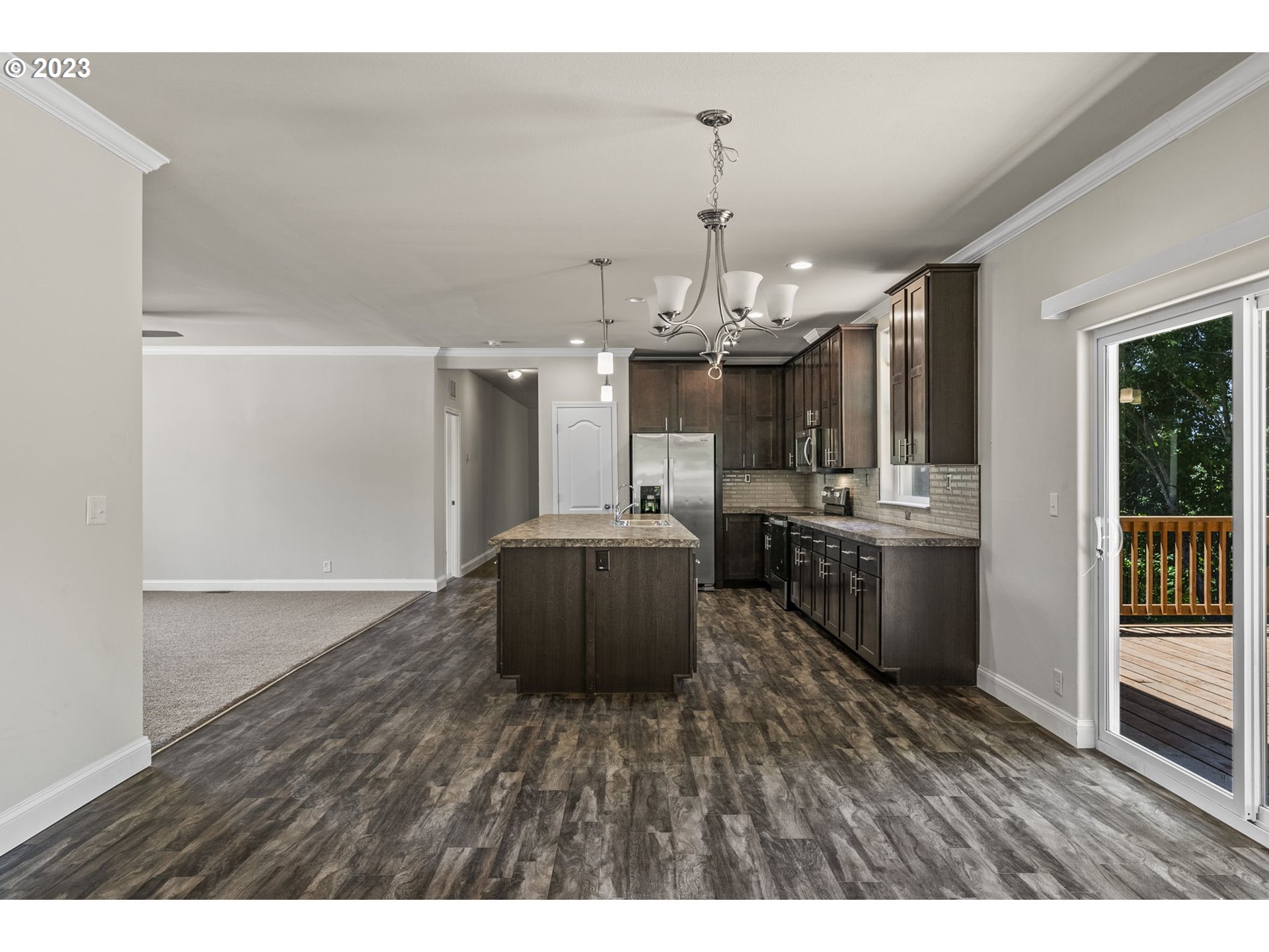 157 P G Sweet Road Kelso, WA 98626 - Photo 8 of 22 a kitchen with stainless steel appliances kitchen island hardwood floor and wooden floors
