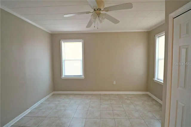 a view of an empty room with a window